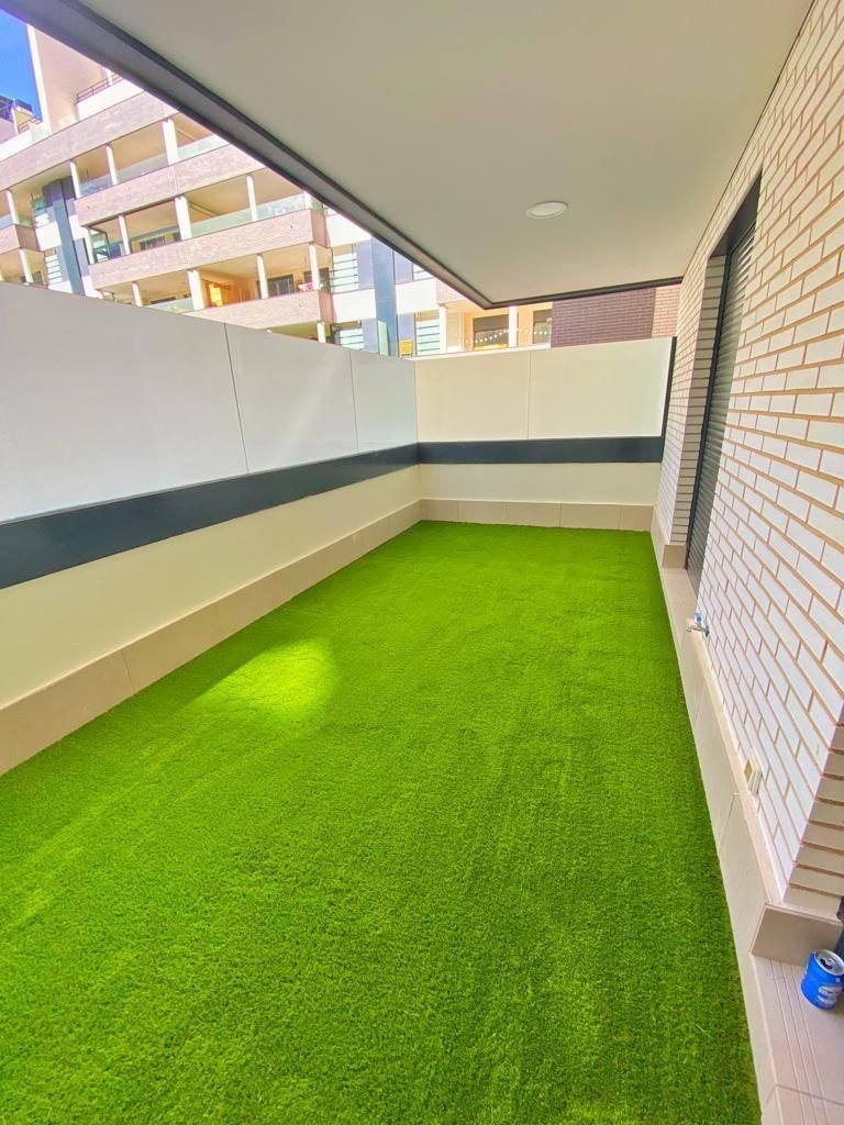 Rooftop artificial grass installation in Madinat Al Sultan Qaboos Muscat